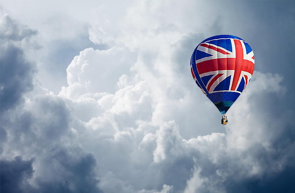 Union Jack hot-air balloon in cloudy sky
